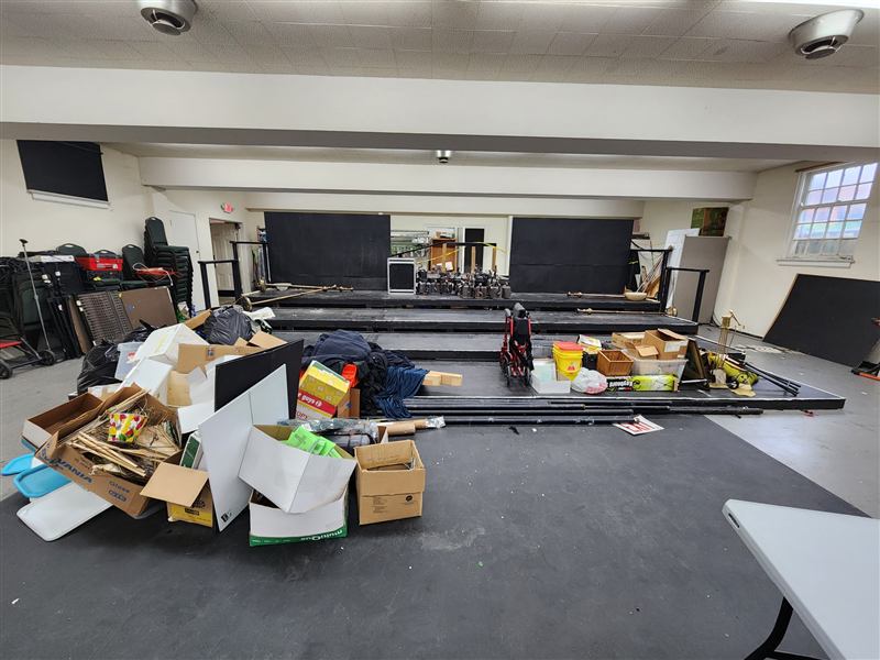 Warehouse cleanout in Chicagoland — before, boxes and debris piled across the floor